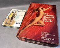 Overview of the book and puzzle box together, showing both items clearly.