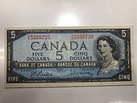 Front side of the 1954 Canadian $5 banknote showing Queen Elizabeth II and serial number.