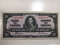 Front side of the 1937 Canadian $10 banknote showing full note with clear image of King George VI portrait and denomination details.