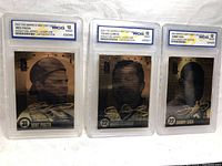 Three 23KT gold baseball cards displayed side by side featuring Mike Piazza, Roger Clemens, and Sammy Sosa, all graded WCG 10 GEM-MT in clear plastic holders.