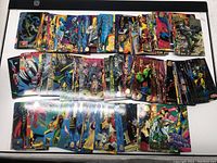Top-down view of three rows of stacked Marvel trading cards from 1993-1994, showing vibrant comic style artwork of various Marvel characters.