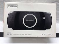 Front view of box showing Micromax G3100 handheld game console image and branding.