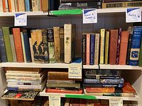Shelf showing classics 2 and container marked Thomas B. Contain with books including The Bounty Trilogy and The Waverley Novels.