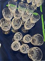 Overhead view of all goblets and tumblers on blue cloth
