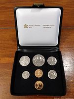 Display case showing seven Canadian coins issued 1979 uncirculated by Royal Canadian Mint.
