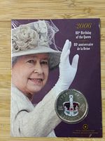 Photo of the coin mounted on packaging with an image of Queen Elizabeth II waving and text '2006 80th Birthday of the Queen / 80e anniversaire de la Reine'