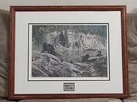 Full framed print showing the wildlife scene with three bears in nature, framed in brown wood, with white matting and under glass.