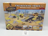 Front box image showing the assembled track with cars and trucks and the main title 'Engineering Track'.