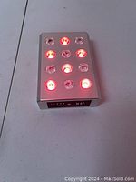 Silver LED panel lit with red lights, viewed from above