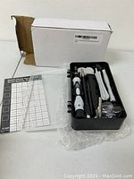 Photo of the screwdriver set with case, tools, and packaging box