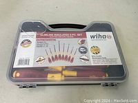 Closed plastic case showing label indicating SlimLine insulated 8 piece set including slotted, Phillips, and square types with 1000V rating, made in Germany.