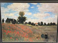 Close-up view of print showing impressionist painting style with red poppies and figures of women and children in a field under a blue sky.