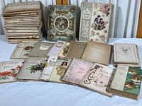 Image showing a large assortment of over 40 vintage books with worn covers. Titles visible include 'Pilgrims of the Night' and 'The Christmas Fairy.'