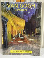 Front view of shrink-wrapped posterbook showing Van Gogh art poster with outdoor cafe at night.