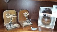 Set of 2 wooden bookends with anchor and rope design, small duck magnet, and boxed wooden candle lamp.
