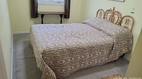 Full assembled double bed with mattress, box spring, bedspread in bedroom