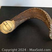 Ram horn lighter showing the lighter mechanism mounted on the horn's end.