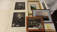 Overview of various portraits, framed scenic photos, and rolled prints showing collection variety