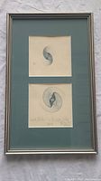 Framed set of two Kernig Nalbardian etchings under glass, showing whole artwork and frame.