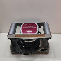 Front view of vintage Master Massager with power cord coiled on plush foot pad.