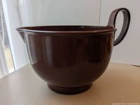 Side view showing the shape, handle and pouring spout of the Dansk mixing bowl.