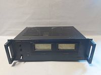 Front panel full view with dual VU meters and handles