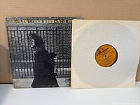 Front cover of Neil Young's Gold Rush album with vinyl LP partially outside inner sleeve.