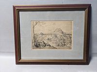 Framed etching print of 'The Flight Into Egypt' by Pieter Brueghel the Elder showing the entire artwork including frame and mat.