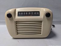 Front view of the Westinghouse Astra tube radio showing tuning dial, knobs, and speaker grille in cream Bakelite case.