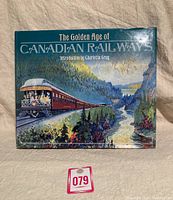Cover of the hardcover book titled 'The Golden Age of Canadian Railways' with illustrated scenic railway train.