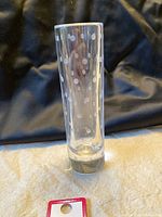 Full front view of clear crystal bud vase showing polka dot pattern