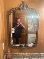 Full frontal view of mirror hanging on wall