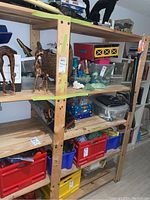 Full view of shelving unit with items stored, showing overall construction and condition.