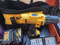 Photo showing DeWalt cordless drill, charger and carrying bag