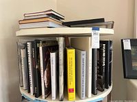Rotating bookshelf with assorted hardcover books