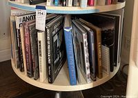 Round shelf display showing all five hardcover books among others