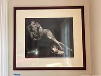 Full front view of framed photograph on wall