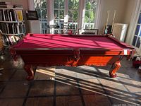 Full side view of pool table in room