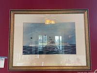 Front view of framed print showing the S.S. Nantucket paddle steamer on water with gold detailed frame and white mat.