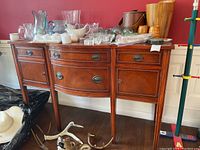Front view of wood sideboard showing two drawers and two cabinet doors