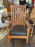 Front view of oak rocking chair in living room