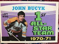 Front of the 1971-72 OPC John Bucyk hockey card showing him in Boston Bruins uniform with 1st All-Star Team 1970-71 text.