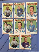 Front view of 8 Buffalo Sabres player cards from 1971-72 O-Pee-Chee hockey card set, showing player portraits and team logo.