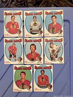 Front sides of eight 1971-72 OPC Chicago Black Hawks hockey cards showing each player's portrait and team name