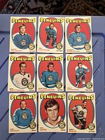 Front side of 9 Pittsburgh Penguins hockey cards from 1971-72 OPC series showing player images, team logo, and player names.