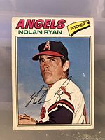 Front of the 1976-77 Nolan Ryan baseball card showing player in Angels pitcher uniform, with name and team branding.