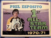 Front of card showing Phil Esposito in Boston Bruins jersey, 1st All-Star Team title, and year 1970-71