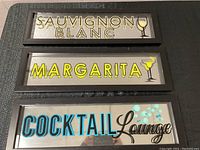 Full front view of the three signs stacked