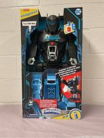 Front view of the sealed Bat Tech Bot robot in original packaging, showing branding and transformation features