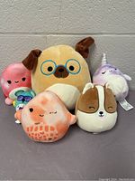 Overview of all six Squishmallow plush toys in lot, showing diverse characters and colors.
